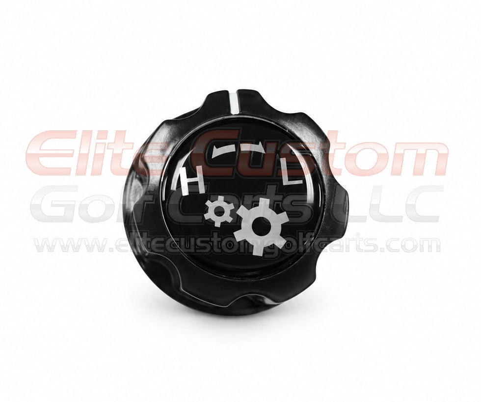 A black plastic gear shift knob with white markings and a gear icon, shown on a white background with a watermark.