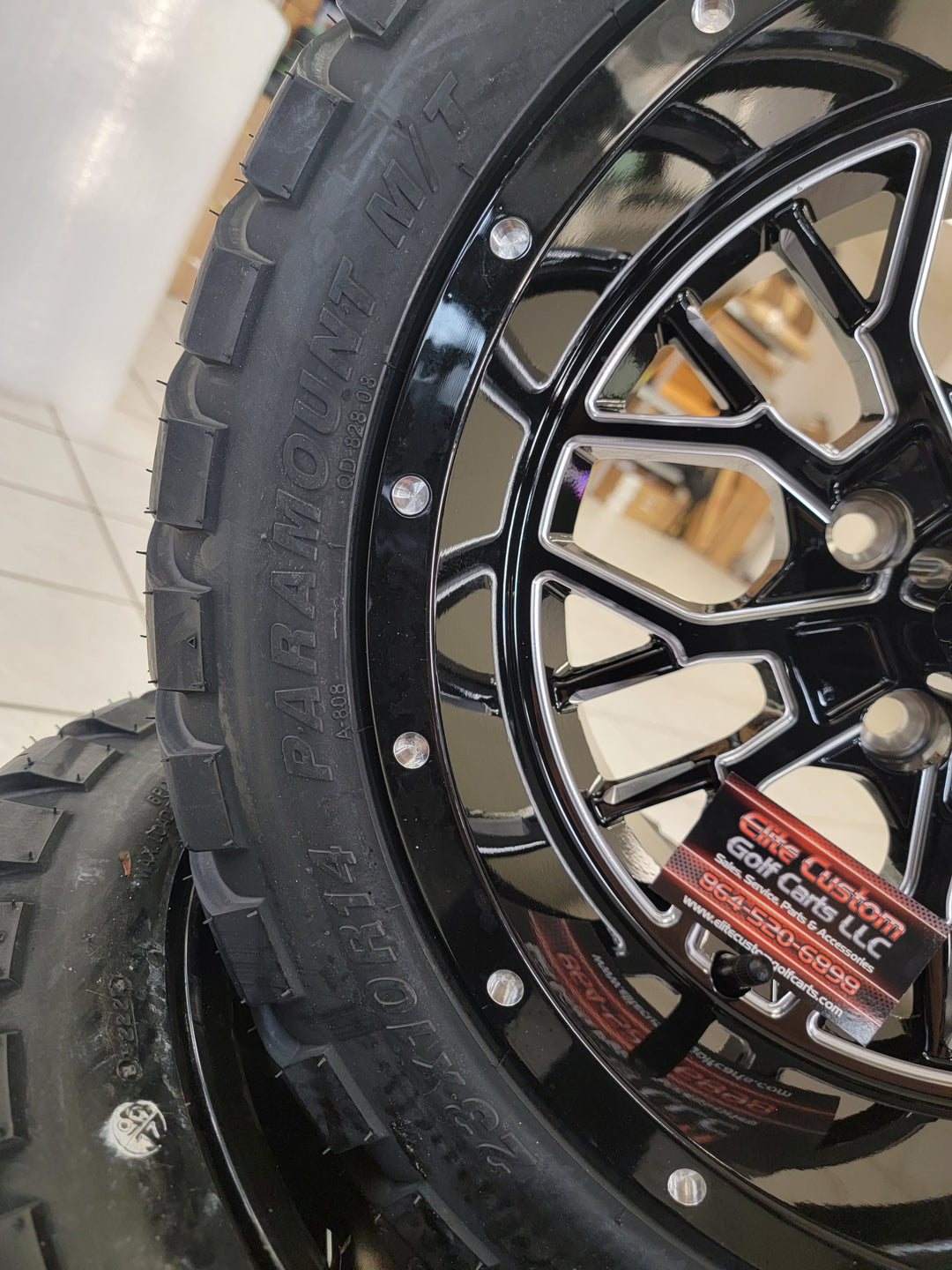 EMPIRE OUTLAW O2 GLOSS BLACK WITH MILLED EDGE &amp; MILLED RIVETS GOLF CART 14" WHEELS ON 14x23" PARAMOUNT ALL TERRAIN TIRES (SET OF 4) optional Lugs